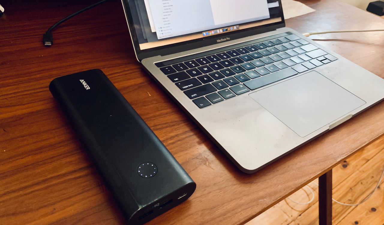 Anker Power Brick with open Macbook